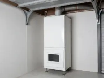 High-efficiency furnace installed in a garage utility closet