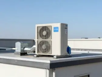Rooftop package unit installed on a small commercial building